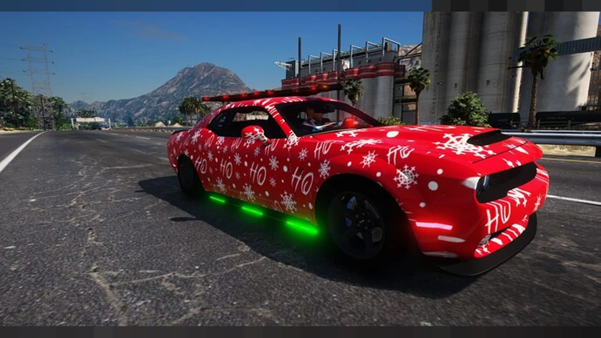 Christmas Dodge muscle car decorated with festive lights and holiday trim