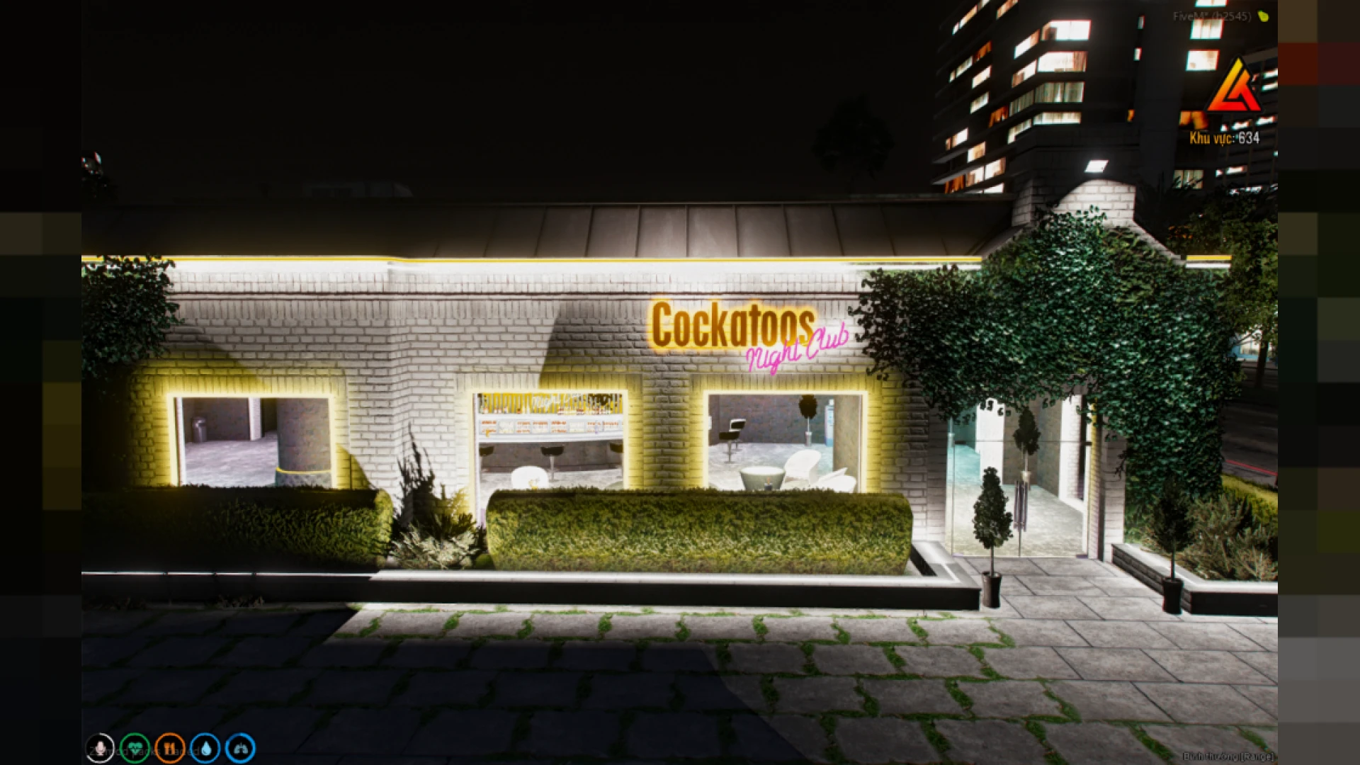 Cockatoos nightclub main floor with neon bar and DJ stage