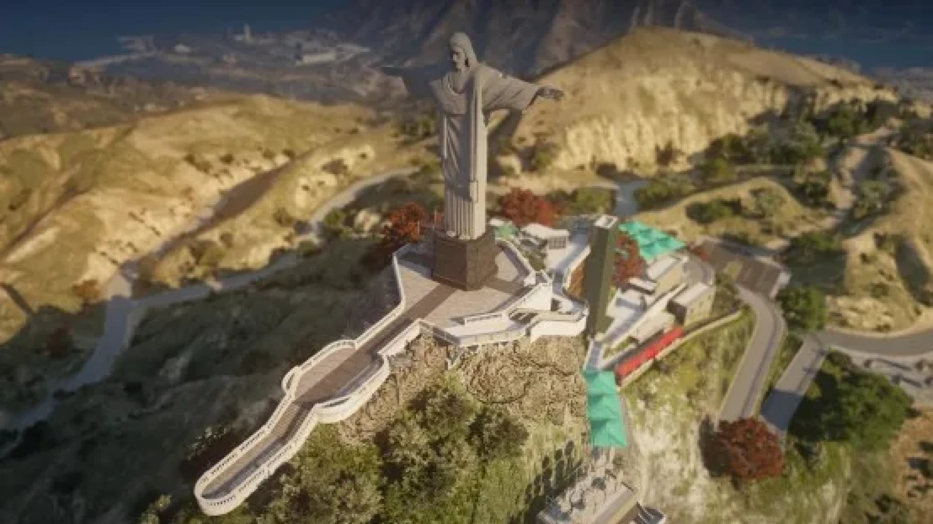 Cristo statue mlo standing on a hilltop with a viewpoint platform