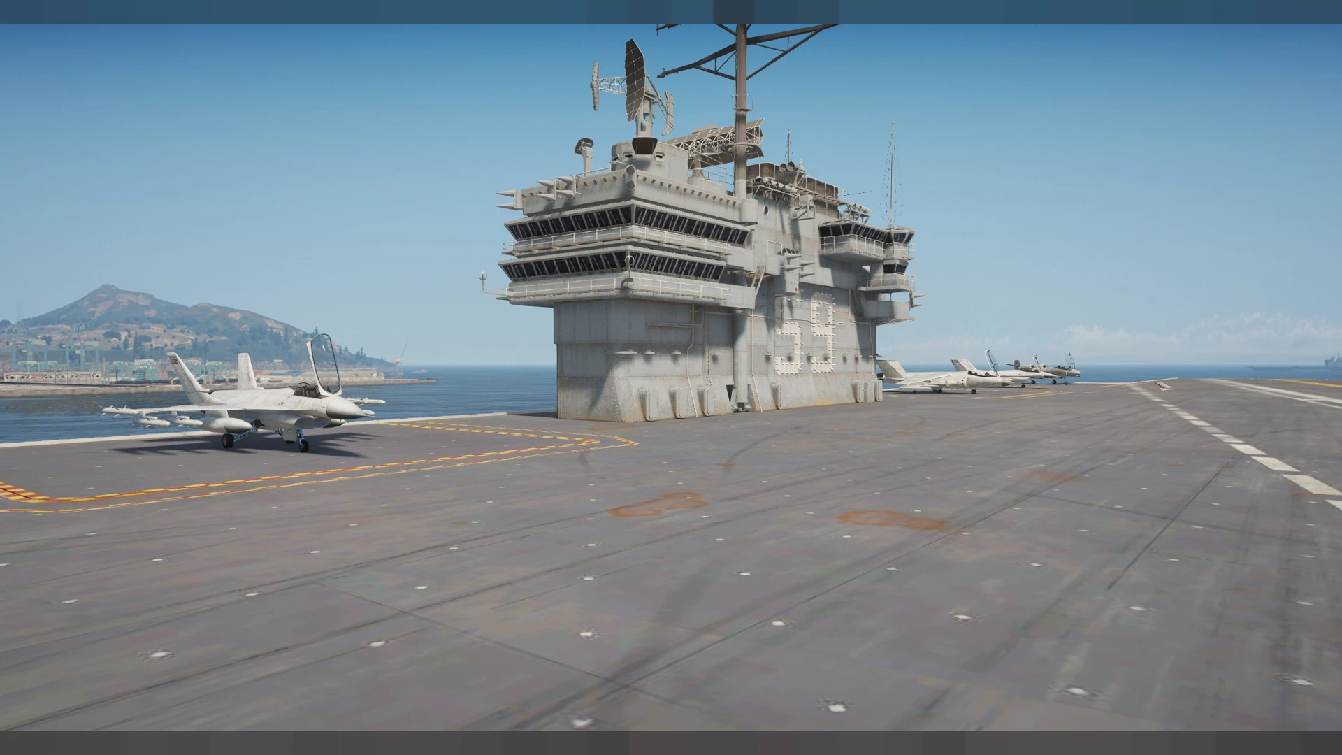 USS Forrestal aircraft carrier with a full flight deck and hangar bays — view 2