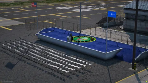 Fort Zancudo ceremony plaza with flags and parade seating — view 2