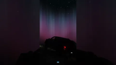 Northern lights aurora glowing over the FiveM night sky — view 2