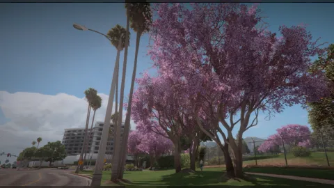 Spring trees with blossom and bright green leaves lining a FiveM street